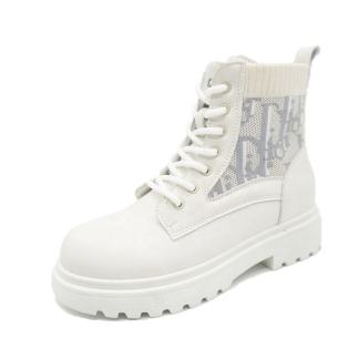 White combat boot with lace-up front and a thick, textured sole.